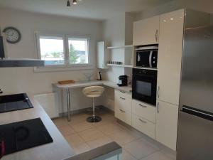 Kuchyň nebo kuchyňský kout v ubytování Entre Lac et Montagne + 20 fotografií