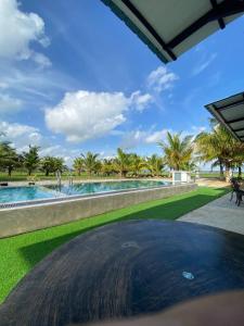 a view of a swimming pool and a resort at Kuala Kedah Pool Cottage in Kuala Kedah +24 photos