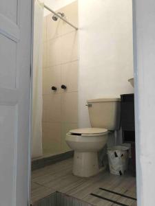 a bathroom with a toilet and a shower at D2 Hermoso condominio privado in Tijuana