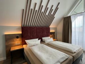 Postel nebo postele na pokoji v ubytování Hotel Mainpromenade ***S