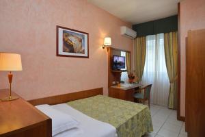 Posteľ alebo postele v izbe v ubytovaní Astor Hotel