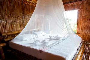 Ein Bett oder Betten in einem Zimmer der Unterkunft Phuree Hut