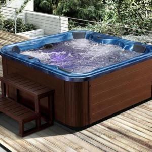 a hot tub sitting on top of a wooden deck at Etna Petit Relais in Nicolosi