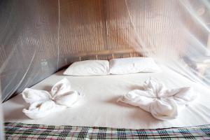 Ein Bett oder Betten in einem Zimmer der Unterkunft Phuree Hut