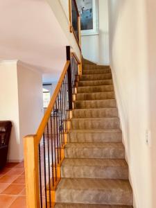 a staircase in a home with a stair case at Super spacious Fremantle Villa 3 Bedrooms 3 Bathrooms in Fremantle