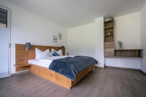 Postel nebo postele na pokoji v ubytování Landart-Appartements