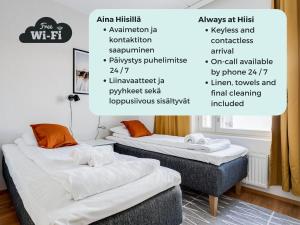 two beds in a room with descriptions of their features at Hiisi Homes Tampere Muotiala in Tampere