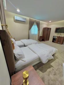 Cama o camas de una habitación en السلطان للشقق المفروشة