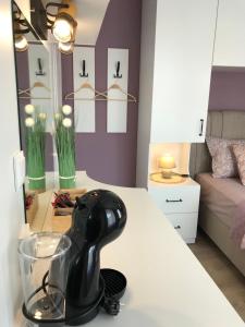 a hair dryer sitting on a counter in a room at AMORE Obzor in Obzor +46 photos