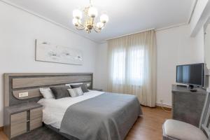 Łóżko lub łóżka w pokoju w obiekcie Amplio y Luminoso en Leioa
