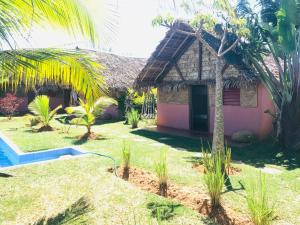 a house with a pool in front of it at Le Trou Normand in Diego Suarez