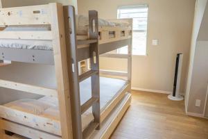 a couple of bunk beds in a room at itotoi本邸 in Itoshima +47 photos