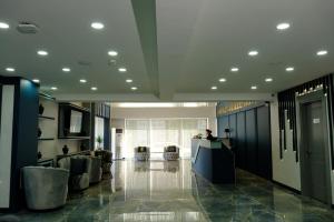 a lobby with a reception desk in a building at GRAND SALİZZE HOTEL in Kestel