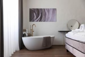 Posteľ alebo postele v izbe v ubytovaní Ansitz Battisti Suites