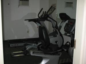 a room with a computer monitor and a treadmill at Pellston Lodge in Pellston