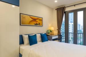 Ένα ή περισσότερα κρεβάτια σε δωμάτιο στο The Home Hotel & Apartment +46 φωτογραφίες