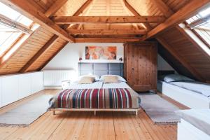 a bedroom with a bed in a room with wooden ceilings at Private Lake House Selce 