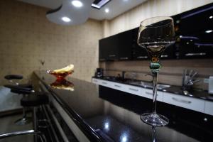 a wine glass sitting on top of a kitchen counter at Lile in Tʼelavi