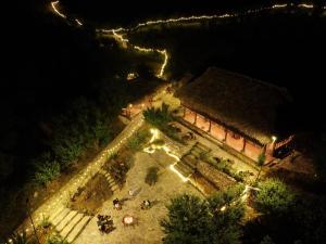 an aerial view of a garden at night at Lagom Bắc Hà Farmstay in Lao Cai