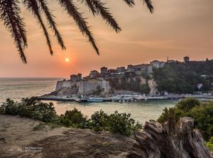 a view of a town on a hill with the ocean at Apartments Zuto in Ulcinj