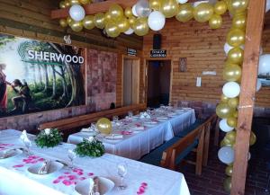 a set of tables in a room with balloons at Sherwood resort in Bihać