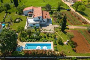 an aerial view of a house with a swimming pool at Apartmani Martina in Poreč +99 photos