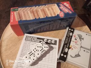 a table with a board game and a box at Um Burebierg apartment 35m2 in Buschrodt