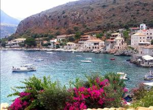 a large body of water with boats in it at Evgenia's Guest House in Neo Itilo