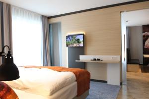 Postel nebo postele na pokoji v ubytování Hafenhotel Meereszeiten