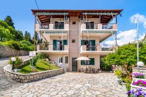 a villa with a view of a building at Nikoleta Studio 2 in Nikiana