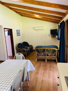 a room with a table and chairs and a couch at BIG4 Taunton Farm in Cowaramup