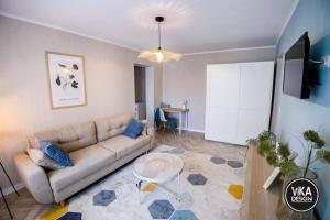 a living room with a couch and a table at Bulevard Apartments 11 in Alba Iulia