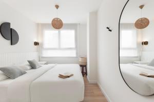 Posteľ alebo postele v izbe v ubytovaní Port Forum Apartments by Olala Homes