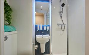 a bathroom with a shower and a sink at For Students Only York House Nottingham in Nottingham +28 photos