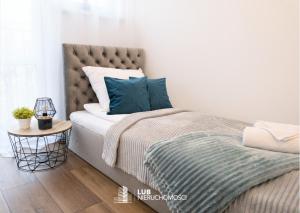 Posteľ alebo postele v izbe v ubytovaní Apartament Skandynawski
