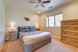 a bedroom with a bed and a ceiling fan at South Lake Tahoe Home with Deck and Gas Grill! in South Lake Tahoe