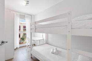Łóżko lub łóżka w pokoju w obiekcie MEDANO4YOU Cabezo Residence