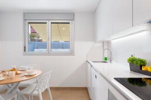 Kuchnia lub aneks kuchenny w obiekcie MEDANO4YOU Cabezo Residence