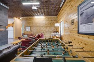 a room with a foosball table in the middle at Pet-Friendly Cabin Retreat Walk to Lake Pepin! in Stockholm