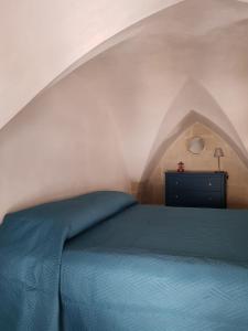 A bed or beds in a room at La casetta del Salento
