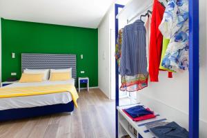 Postel nebo postele na pokoji v ubytování YourHome - Relais Loggia Li Galli