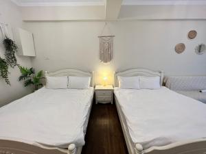 Postel nebo postele na pokoji v ubytování 海沐輕旅 Sea Mu Kenting + 22 fotografií