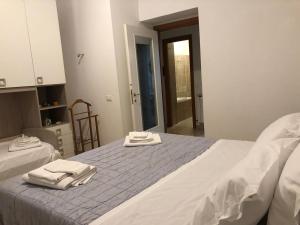 Postel nebo postele na pokoji v ubytování Manarola apartament
