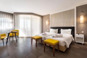 Кровать или кровати в номере AP Oriental Beach - Adults Friendly