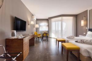 Телевизор и/или развлекательный центр в AP Oriental Beach - Adults Friendly