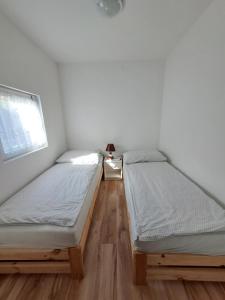 Postel nebo postele na pokoji v ubytování Warmiński Domek