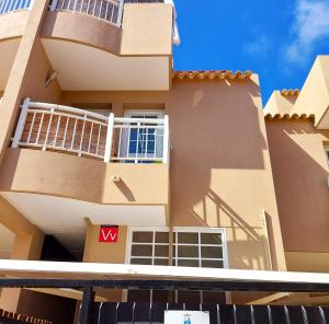 a building with a m sign in front of it at SMALL APARTMENT, Adeje House Wifi Free in Adeje