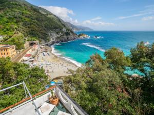 a view of a beach and the ocean at Villa Tanca With AC, Terrace and Views in Monterosso al Mare