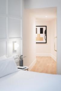 Postel nebo postele na pokoji v ubytování Cosmo Hotel Boutique