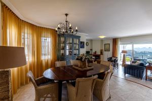 a dining room with a table and chairs at Altea Buena Vista in Altea